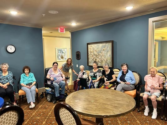 Residents participating in a group activity in a common area