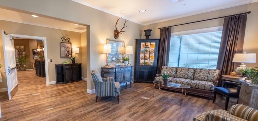 Cozy living room with a couch and armchair at Amber Creek Inn