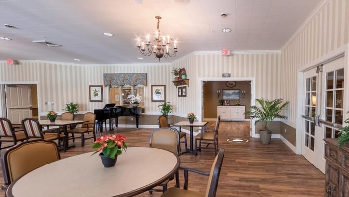 Comfortable lounge area with piano and seating at Amber Creek Inn