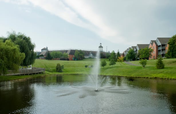 Scenic view of a pond with a fountain at Asbury Springhill