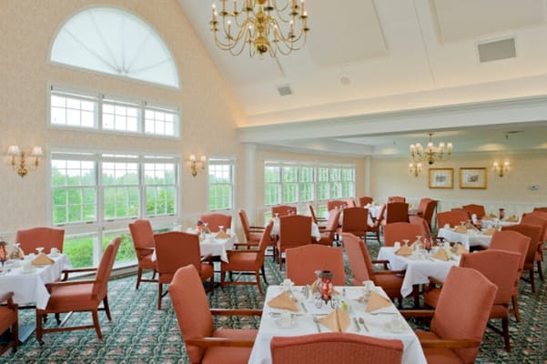 Well-decorated dining room with tables set for meals