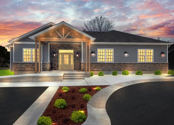 Exterior view of Aspen Valley Senior Homes with landscaped entrance