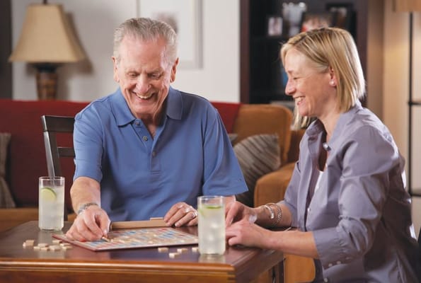 Residents playing a board game together