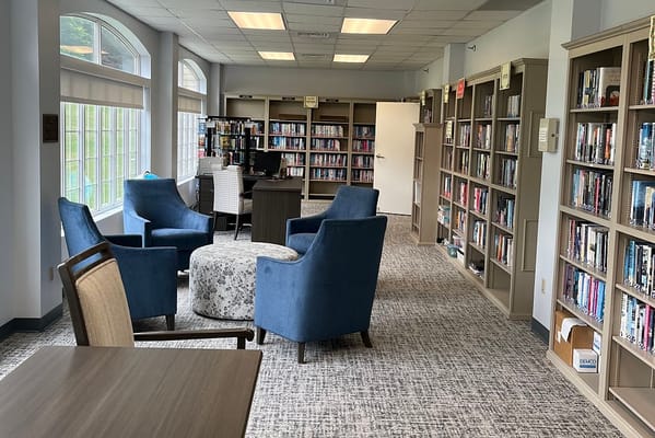 Interior view of a cozy library with seating