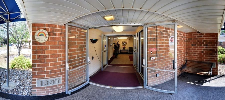 Entrance to Azria Health Park Place with a welcome sign
