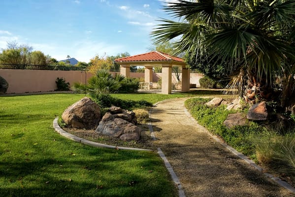 Pathway leading to a gazebo in a garden