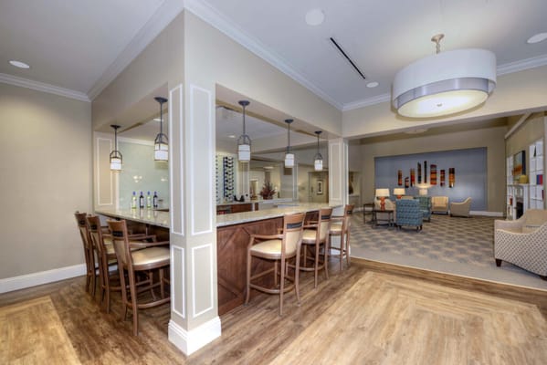 Spacious common area with seating and bar