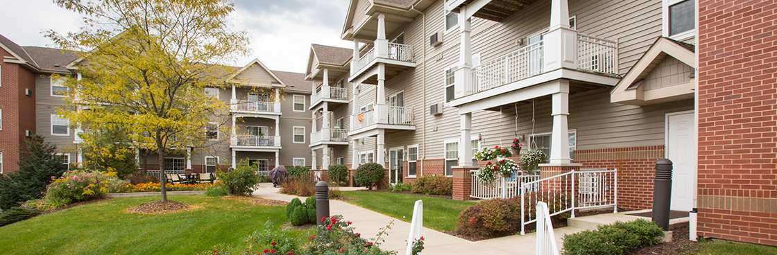Exterior view of residential buildings and gardens