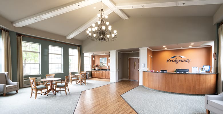 Bright lobby area with seating and reception desk