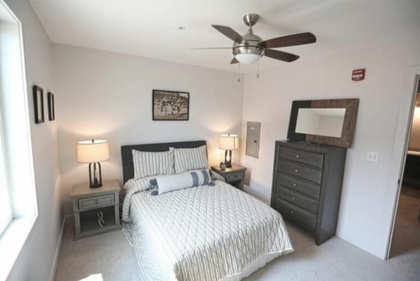 A well-decorated private bedroom in a senior living facility