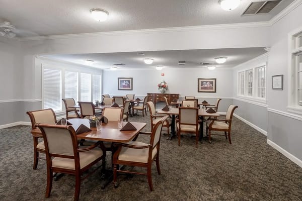 Bright and inviting dining room with tables and chairs.