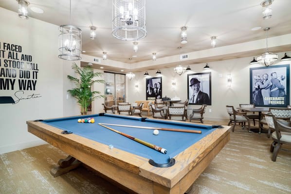 Interior view of a recreational area with pool table