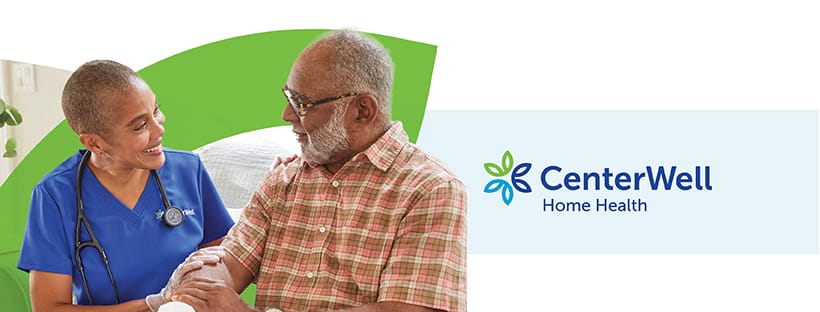 A caregiver and a senior client smiling and engaging in conversation.