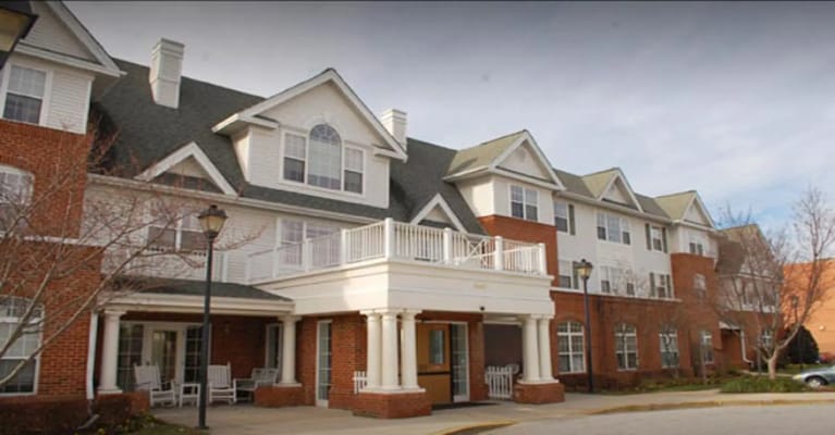 Front entrance of Charter Senior Living facility with a porch
