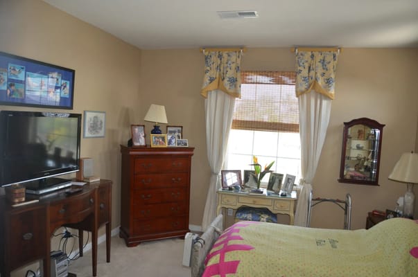 Cozy bedroom with floral decor and personal mementos