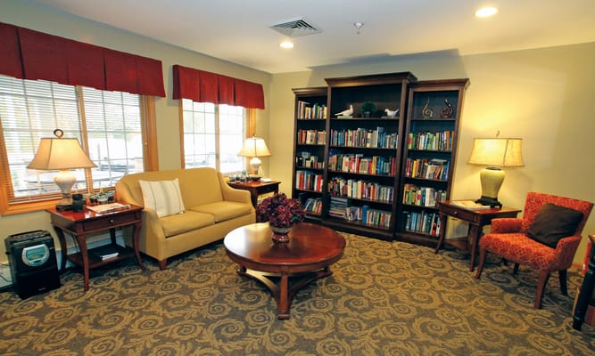 Cozy common area with bookshelf and seating