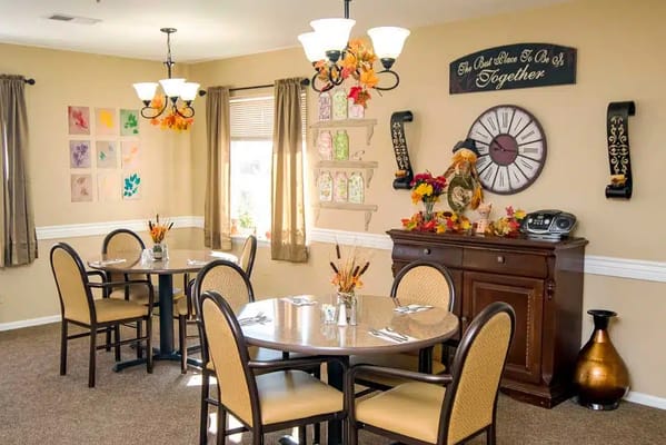 Dining area with decorated tables and wall art