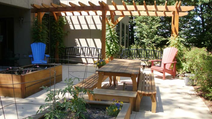 Outdoor patio area with seating and garden