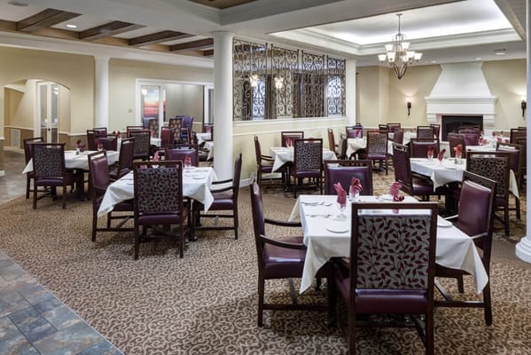 Dining room with tables set for residents