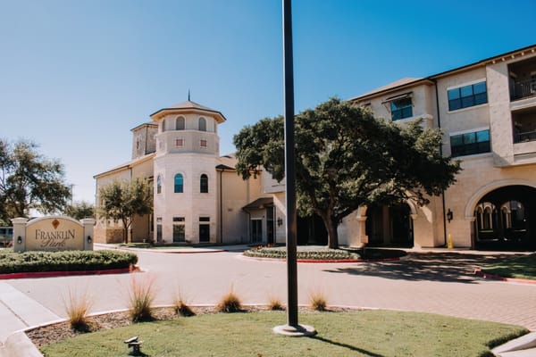 Exterior view of Franklin Park Sonterra with entrance and landscaping