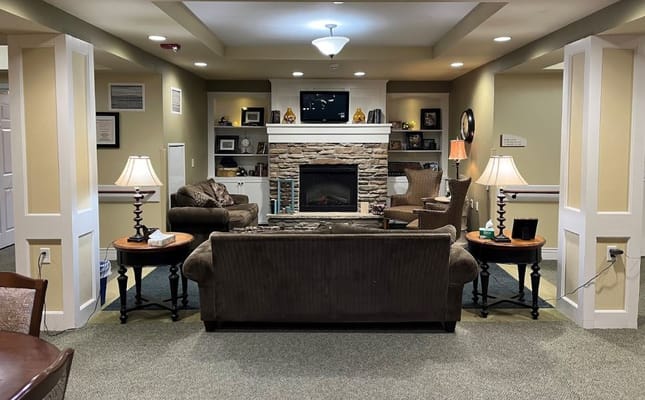 Cozy common area with seating and a fireplace