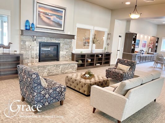 Comfortable living room with seating and a stone fireplace