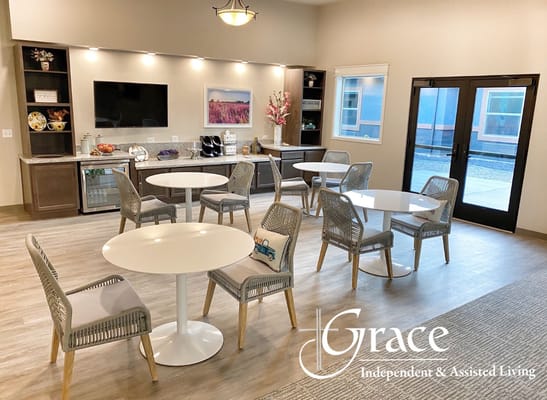 Bright common area with round tables and chairs