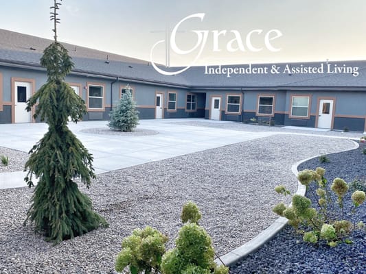 Beautiful courtyard featuring landscaping elements at Grace Assisted Living