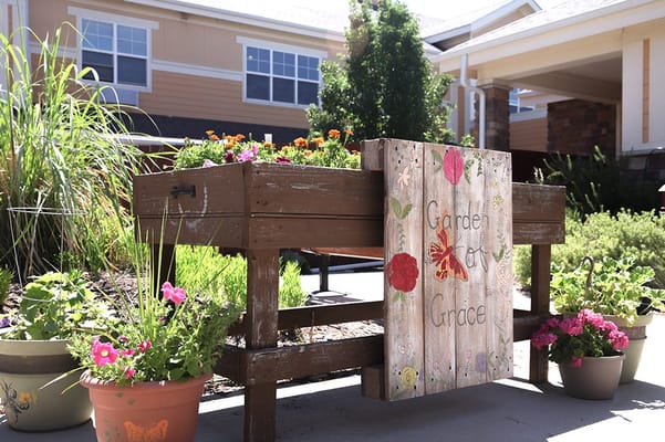 Flower garden sign and planter boxes outside