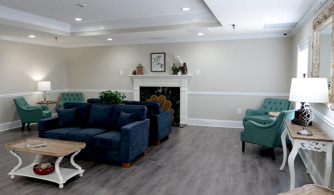 Cozy living room with blue and green seating areas