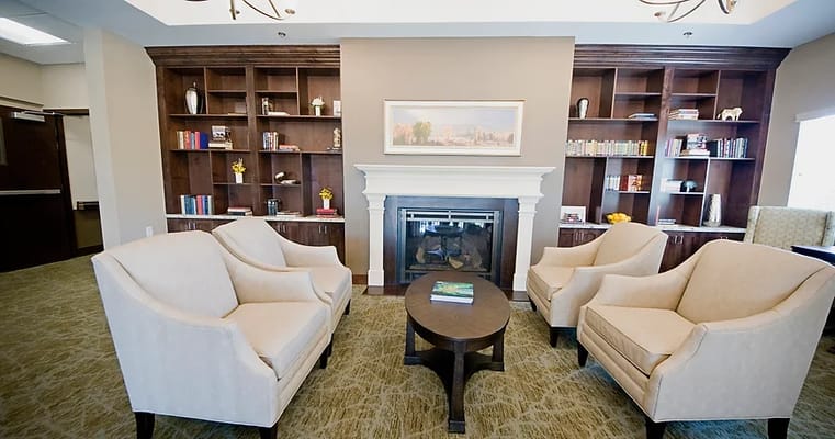 Cozy lounge area with chairs and a fireplace