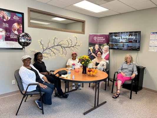 Residents celebrating a birthday in a common area