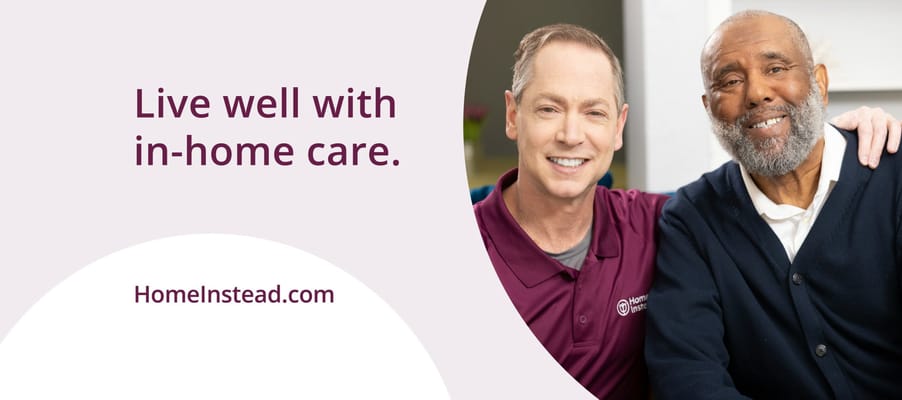 Two smiling individuals enjoying friendly company