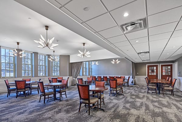 Bright common area with tables and chairs