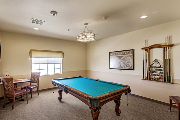 Interior view of a game room with a pool table