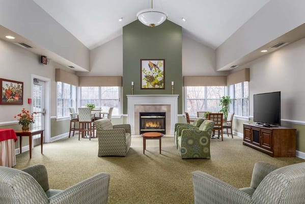 Spacious common area with seating and a fireplace