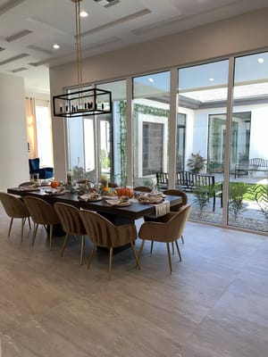 Dining area set for a meal with outdoor view