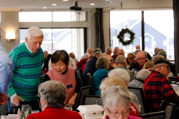 Residents enjoying a meal in a dining room