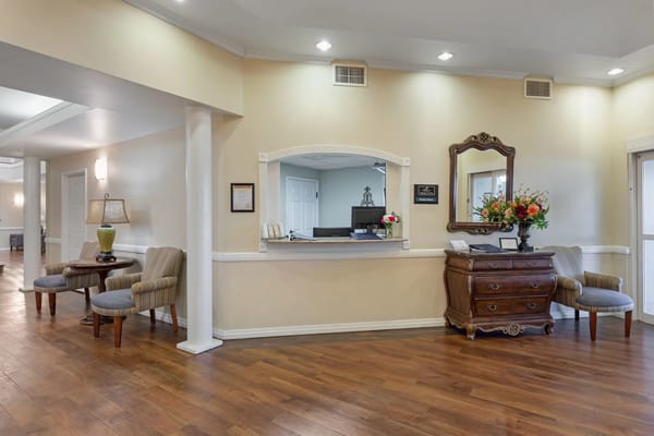 Spacious lobby area with decorative furniture and a reception desk