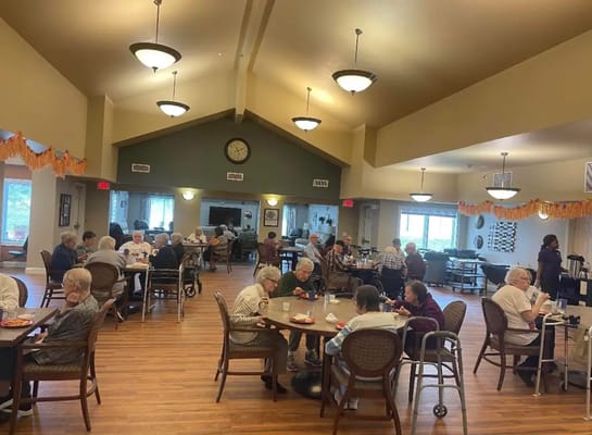 Residents enjoying meals in a common area