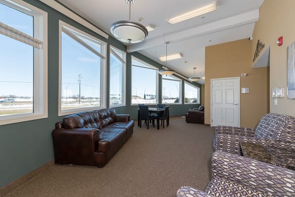 Common area with large windows and seating