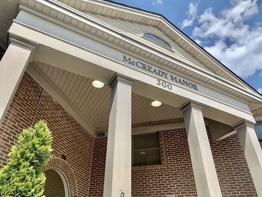 Entrance to McCready Manor with signage