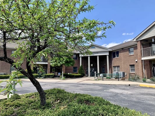 Front view of McCready Manor with greenery.
