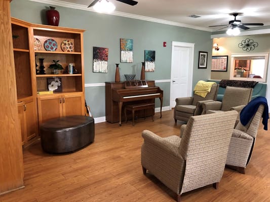 Comfortable seating and piano in a living area