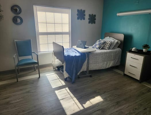 Cozy resident room with a bed and desk