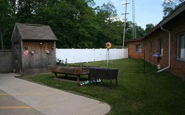 Outdoor space with garden and shed in the facility yard