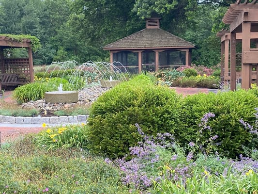 Beautiful outdoor garden with fountain and seating area