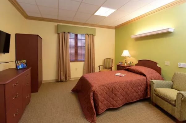 Cozy private room with bed and furniture