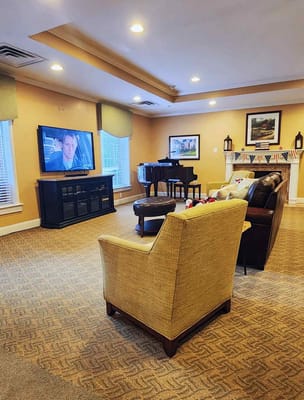 Cozy common area with seating and piano