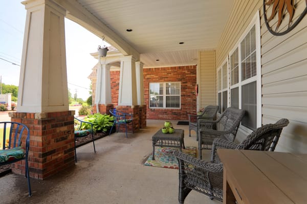 Covered porch area with seating